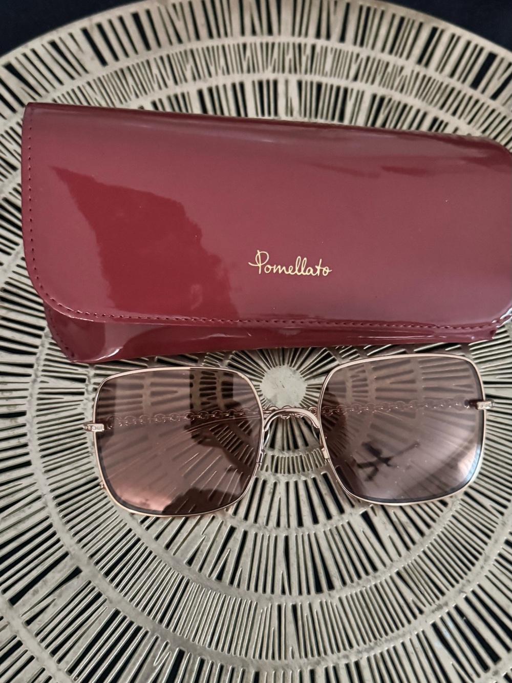 Pomellato Women's Burgundy Frame Sunglasses with Gold Accents